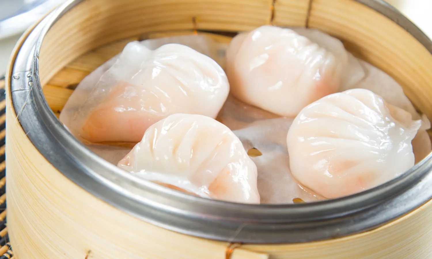 Crystal shrimp har gow dumplings in bamboo steamer